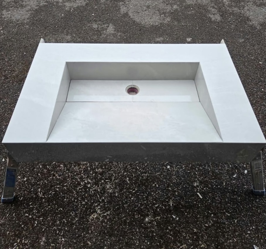 Custom-made basin formed with mitred edges for a clean, seamless finish.